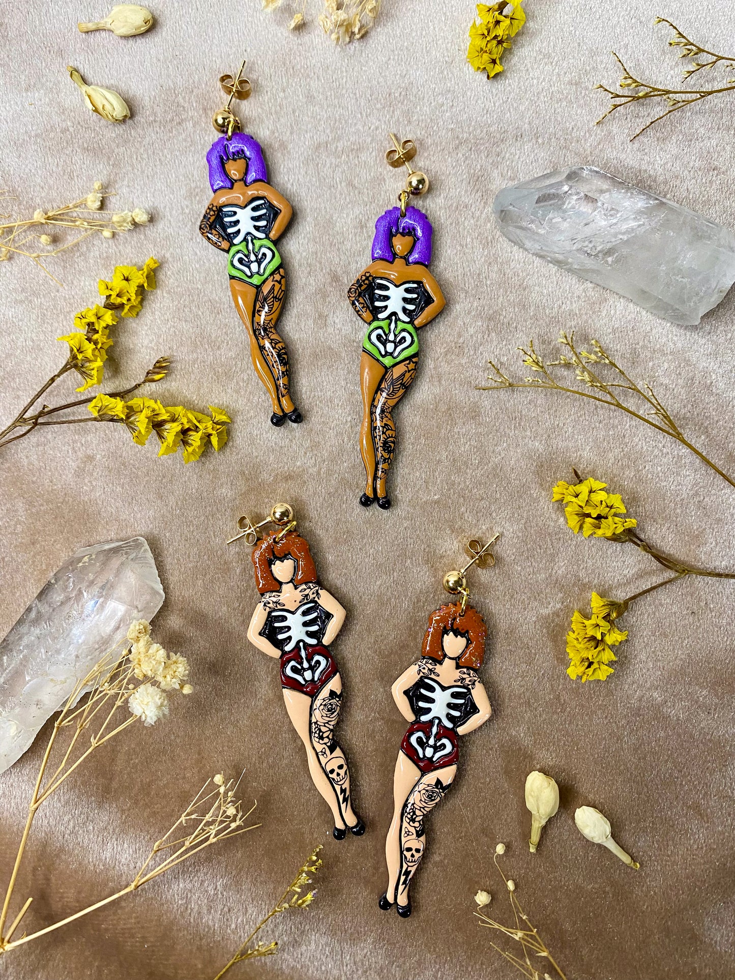 polymer clay and resin glow in the dark skeletal skeleton babe tattoo girl dangle earrings
