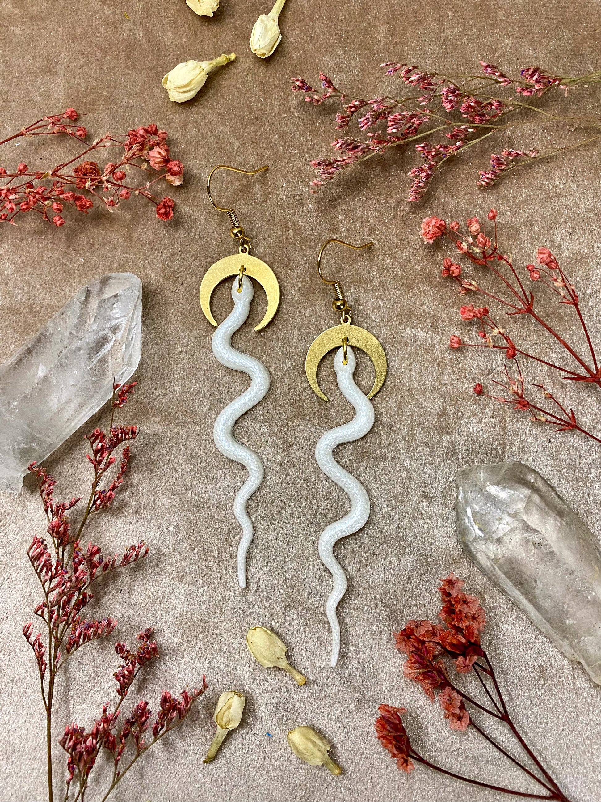 white resin snake dangle earrings