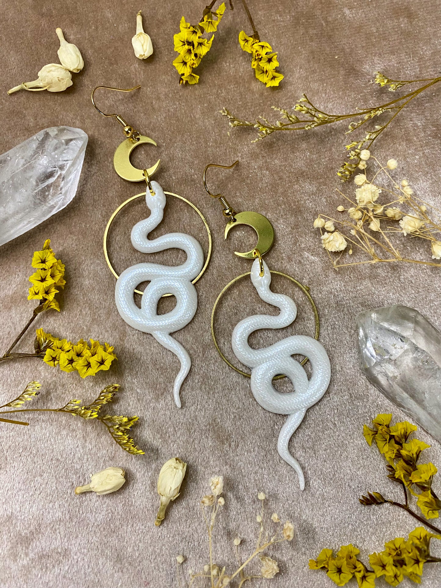 white resin snake dangle earrings