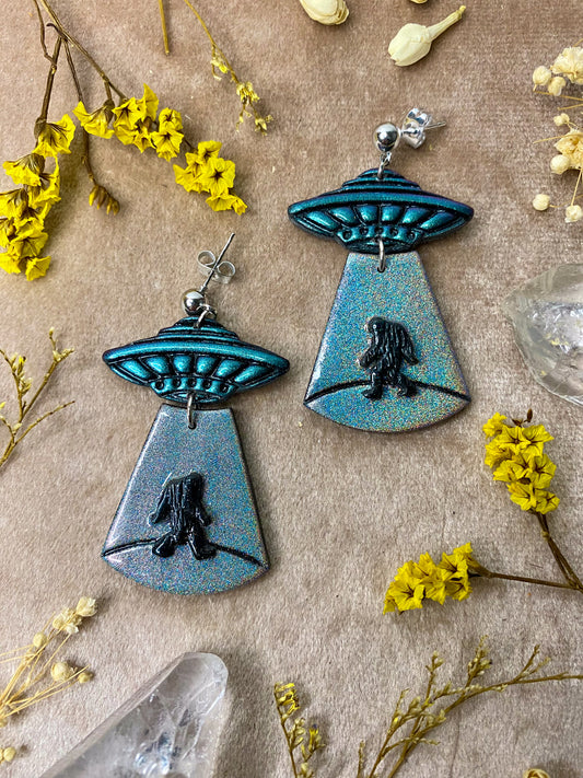 polymer clay and resin holographic bigfoot alien abduction earrings