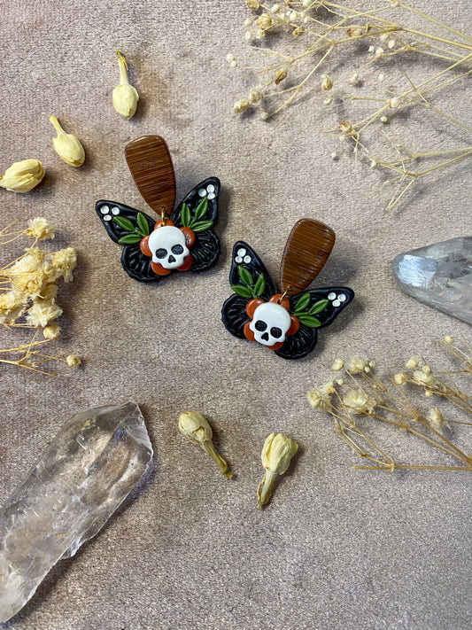 polymer clay butterfly skull and wood dangle earrings
