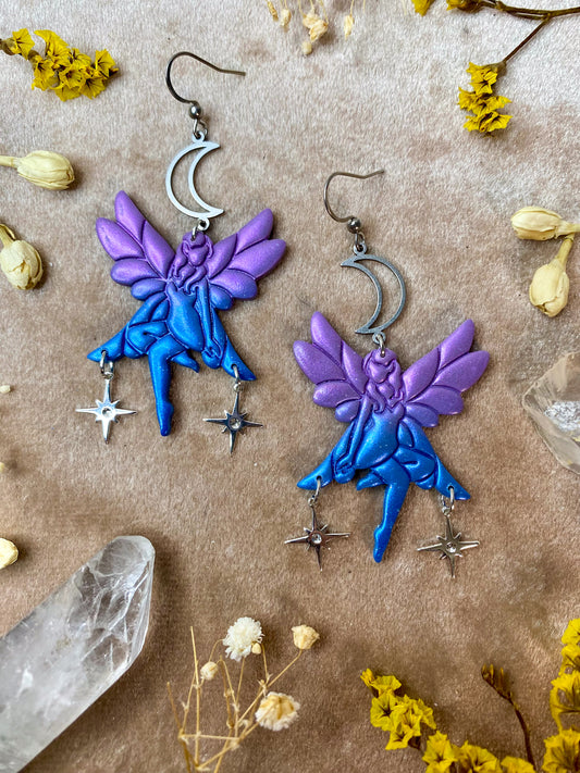 purple and blue sitting fairy with stars and moon polymer clay fantasy dangle earrings