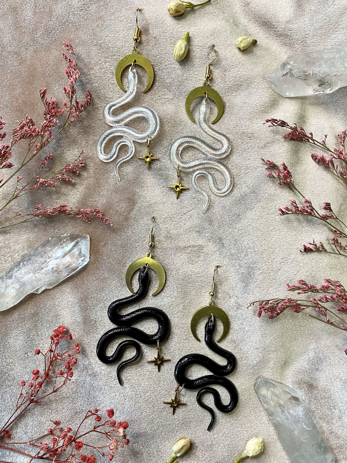 Black and transparent snake earrings