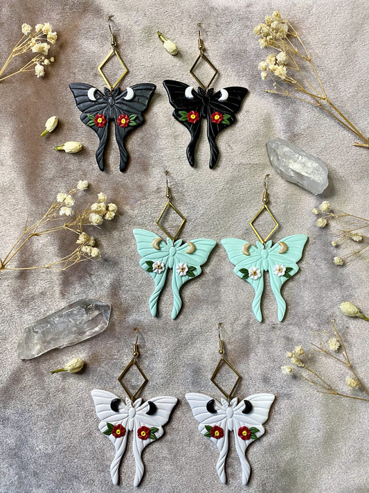 black, white and mint floral luna moth clay earrings
